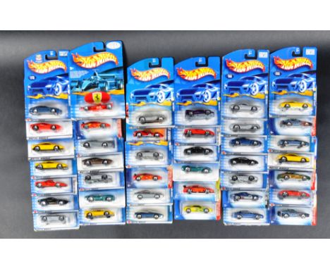 A large collection of approximately x40 carded Mattel made Ferrari Hot Wheels diecast model cars to include; Ferrari 250, Fer