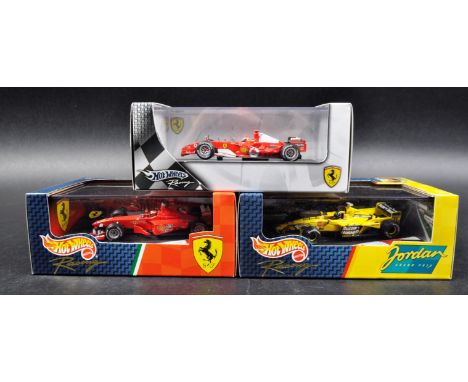 A collection of x3 Mattel made Hot Wheels 1/43 scale boxed diecast model F1 Formula One racing cars comprising; 1999 Ferrari 