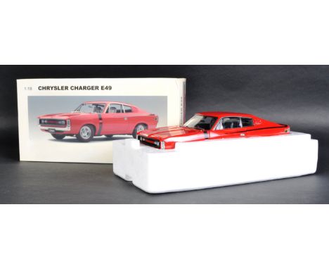 An Autoart Millennium Chrysler Charger E49 diecast model. 1/18 scale. All contents appear mint, in original box.
