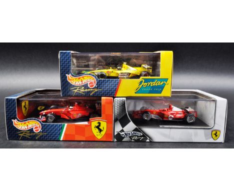 A collection of x3 Mattel made Hot Wheels 1/43 scale boxed diecast model F1 Formula One racing cars comprising; 1999 Ferrari 