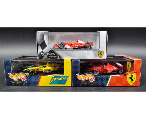 A collection of x3 Mattel made Hot Wheels 1/43 scale boxed diecast model F1 Formula One racing cars comprising; 1999 Ferrari 