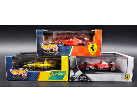 A collection of x3 Mattel made Hot Wheels 1/43 scale boxed diecast model F1 Formula One racing cars comprising; 1999 Ferrari 