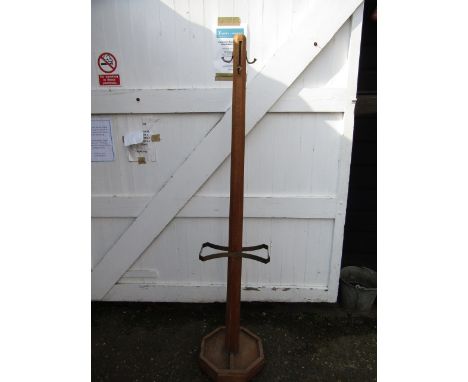 An oak arts and craft coat and stick stand with trays