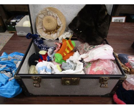 A trunk of dolls clothing