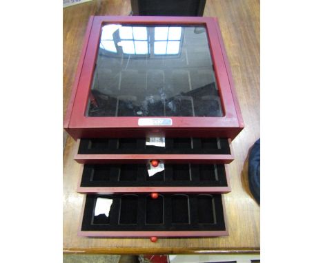 A Zippo lighter display case with 4 tiers