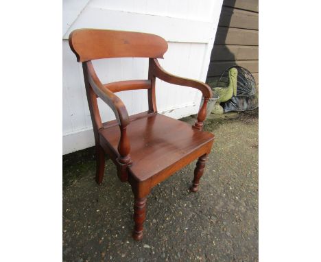 A vintage open arm chair