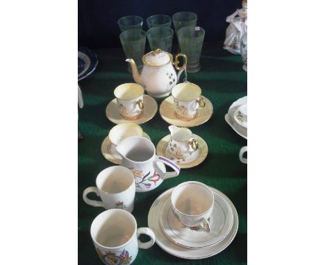 A Shelley part duet tea set, gilt decorated with fruit on a shaded yellow ground, a Poole milk jug and various other items.