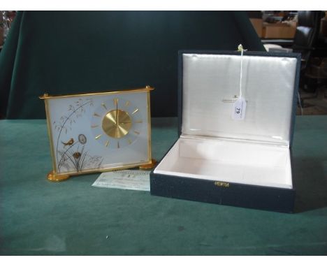 A 1960's Jaeger-LeCoultre Marina mantle clock in a perspex and gilt metal case, decorated with nesting birds 21.5cm wide in a