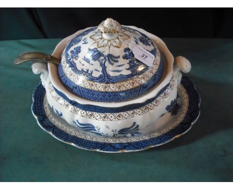 A Staffordshire blue and white transfer printed tureen and cover with associated stand an plated ladle.