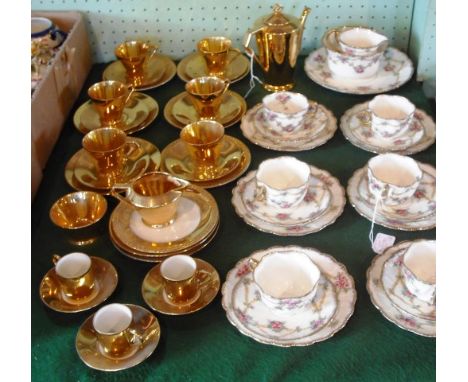 A six setting part-tea set, transfer printed and painted with flowers, a gilt six setting part-tea set by Noritake and a Fren