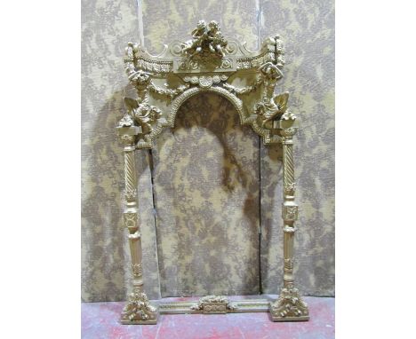 A large and impressive arched alcove painting / mirror frame, surmounted with putti playing instruments, the pediment support