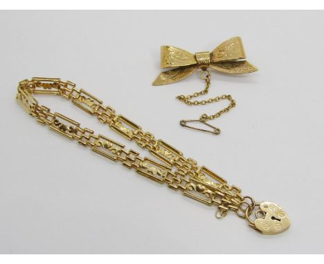 Antique style 9ct engraved bow brooch, maker 'P&amp;W', Birmingham 1960 and a 9ct fancy heart gate link bracelet with padlock