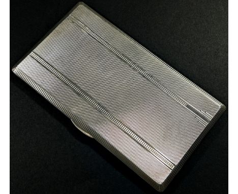A silver engine turned cigarette case with gilded interior, Birmingham, 1946, makers mark William Suckling Ltd, 15x8.5cm, 7.9