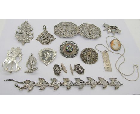 Interesting collection of silver and white metal jewellery to include an Eastern nurses buckle of pierced foliate design, a V