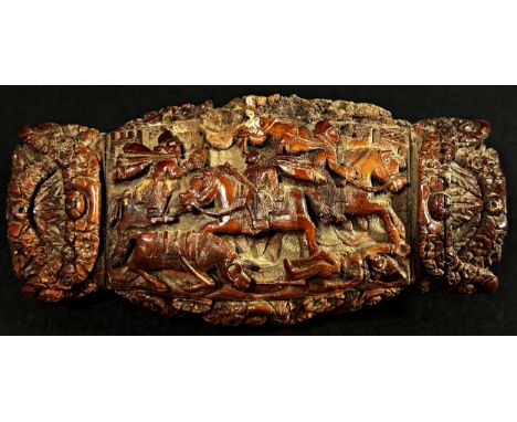 A large 19th century coquilla nut snuff box, with hinged cover, profusely carved with a chariot scene, set within floral garl
