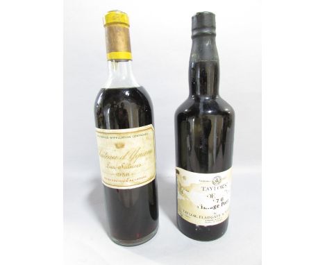 A vintage Taylor’s Quintas De Vargelass Port 1976 (label torn) and a 1958 vintage bottle of Chateau d’ Yguem Lur Saluces