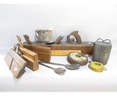A large vintage B. White wood plane 55cm long, three smaller wood planes/routers, a Lufkin USA 33 ft tape measure, a vintage 