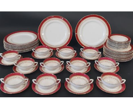 A quantity of Royal Worcester 'Regency' pattern tea and dinner wares in crimson and gilt colourway comprising twelve piece se