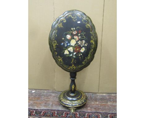 A Papier Mache tilt top centre table, the oval top with floral, gilt and mother of pearl decoration, set on a turned pillar a