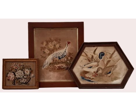 Three 19th century framed tapestries, to include: a bouquet of flowers, 19 x 22.5 cm; pheasant in a garden, 42 x 36 cm; toget