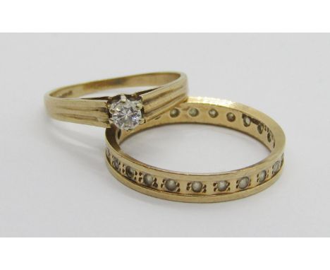 9ct melee diamond solitaire ring, size L and a further 9ct white stone eternity ring, size P, 3.3g total 