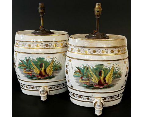 A pair of decorative ceramic spirit barrels with gilt borders and painted pond side vignettes (converted to lamps) each 47cm 