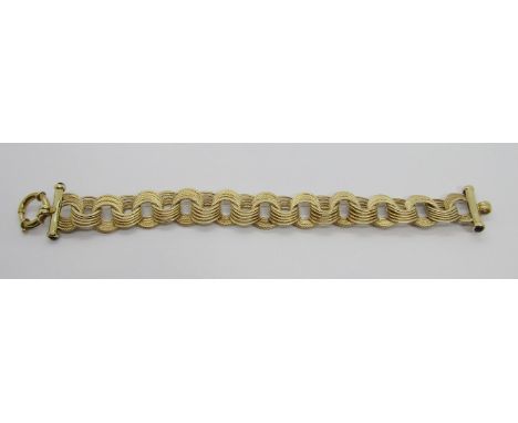 9ct fancy link bracelet with black cabochons terminals and bolt ring clasp, maker 'TGCC', 20cm L approx, 17g 