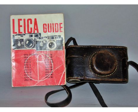 A vintage black Leica DRP Ernst Leitz camera serial number 117403 with its original black leather case and shoulder and Leica