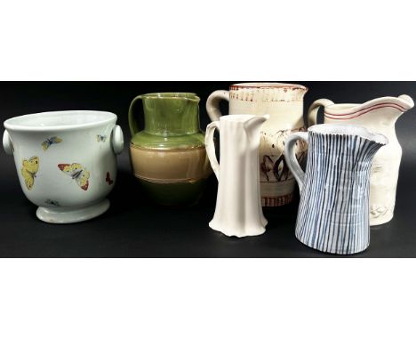 Mixed Studio ware and other jugs, a pair of porcelain baluster desk lamps, a silver plated cloche, tray, clear cut glass ewer