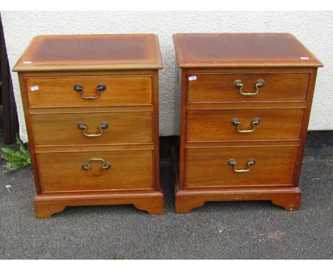 A pair of good quality Georgian style mahogany bedside cabinets, each fitted with three drawers with brass loop handles, rais