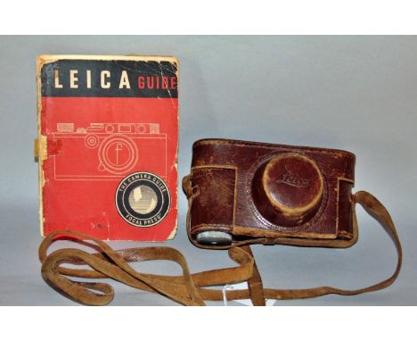 A vintage Leica DRP Ernst Leitz camera serial number 202493, with its original case and shoulder strap together with a Leica 