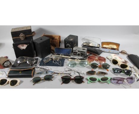 Various spectacles, vintage and retro, sunglasses, cameras, a Six-20 Popular boxed camera, 11cm high, etc. (a quantity)