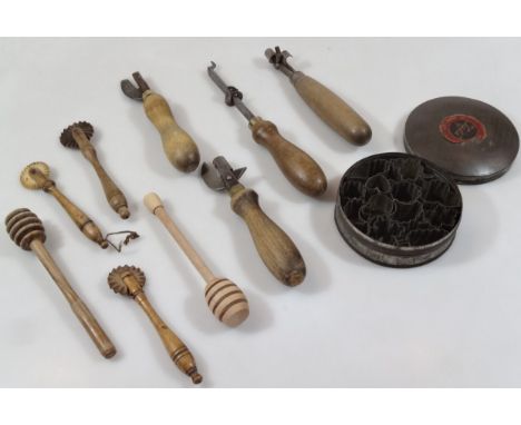 Various late 19thC and early 20thC treen, to include hand pastry cutters and rollers 12cm high, etc., other hand tools, etc. 