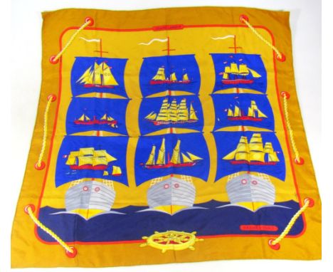 A Hermes Paris P Peron silk scarf, decorated with ships and liners, with part rope twist outline predominantly in blue, red a