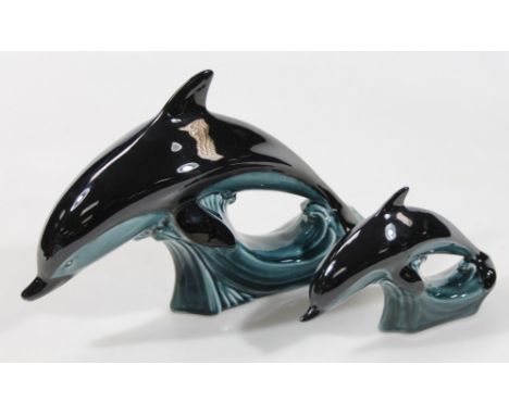 A graduated pair of Poole Pottery dolphin figures, 20cm high, etc. (2)