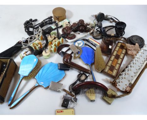 Various Art Deco and other hair clips, 14cm wide, etc., part dressing table set, metal musical jar, a quantity of lighters to