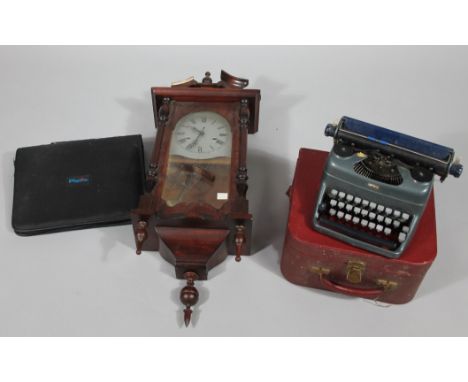 A mid 20thC typewriter, of small proportion, 22cm wide, unmarked, in fitted case, a modern Plavix filofax style lap top case 