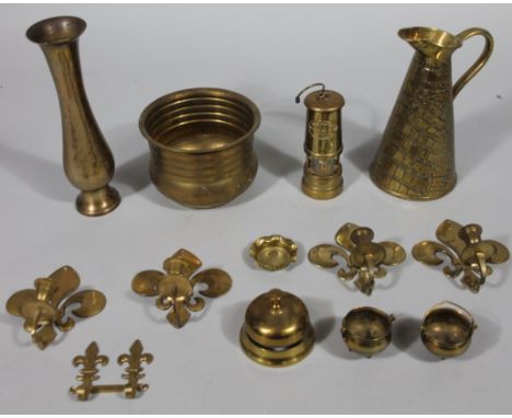 Various brassware, early 20thC and other to include a graduated jug, 26cm high, porter's bell of circular outline, Ashington 