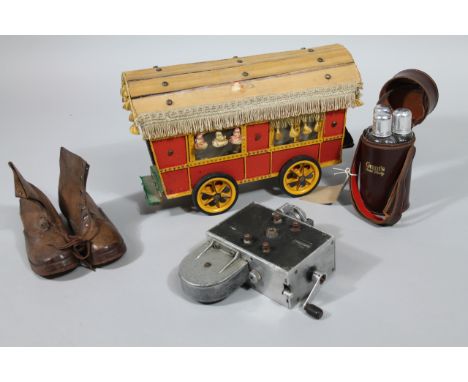 A pair of early 20thC and leather shoes, with wooden heels numbered 27, in brown with laces, 23cm wide, a scratch built woode