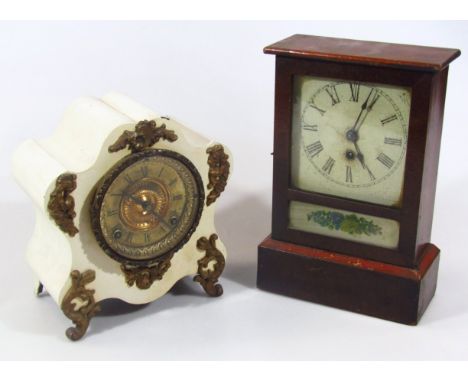A very late Victorian painted metal mantel clock, with elaborate 11cm dia. Roman numeric dial fitted in a serpentine case rai