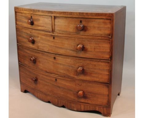 A George III mahogany bowfront chest, of small proportion with two short and three long drawers, on stylised bracket feet, 98