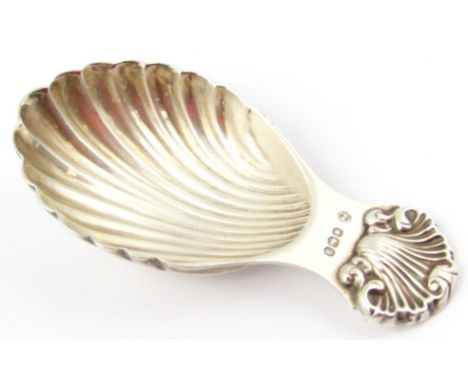 An Elizabeth II silver caddy spoon, with shell shaped handle and feathered bowl, Sheffield 1969, 7cm wide.