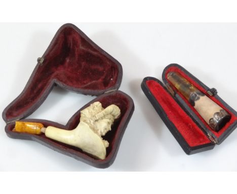 A very early 20thC meerschaum and carved pipe, formed as a lady wearing bonnet, 5cm high, in fitted case, (AF), and a further