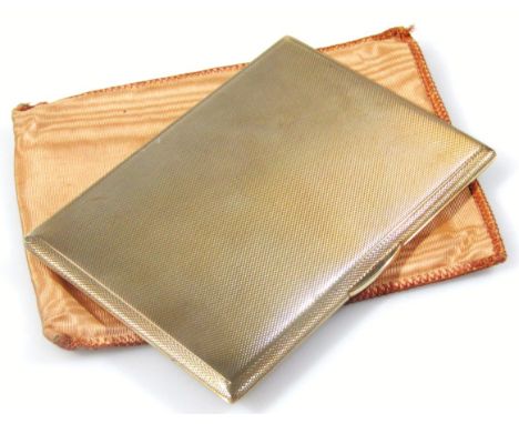 An Elizabeth II 9ct gold cigarette case, of rectangular engine turned outline, engraved to the interior, London 1956, 12cm wi