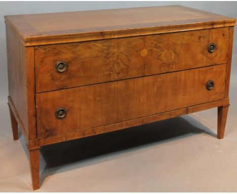 A late 19thC/early 20thC commode, the rectangular top with a wide cross banding raised above two drawers with ring turned han