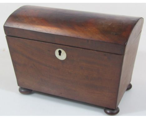 An early 19thC flame mahogany domed top tea caddy, with fitted interior on compressed bun feet, 14cm high 21cm wide, 13cm dee