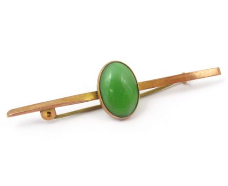 A bar brooch, set with central green jade coloured stone, yellow metal, marked 9ct, 3.2g all in.  