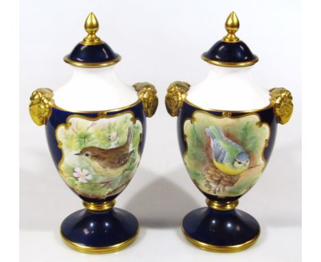 A matched pair of Caverswall hand painted limited edition vases, by W R Tipton, each with domed lids, urn shaped bodies, ram 