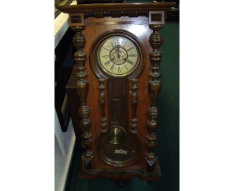 Late 19th C walnut Vienna wall clock with two train spring driven movement