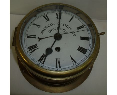 Brass cased wall mounted clock by Prescot Clock Co. 